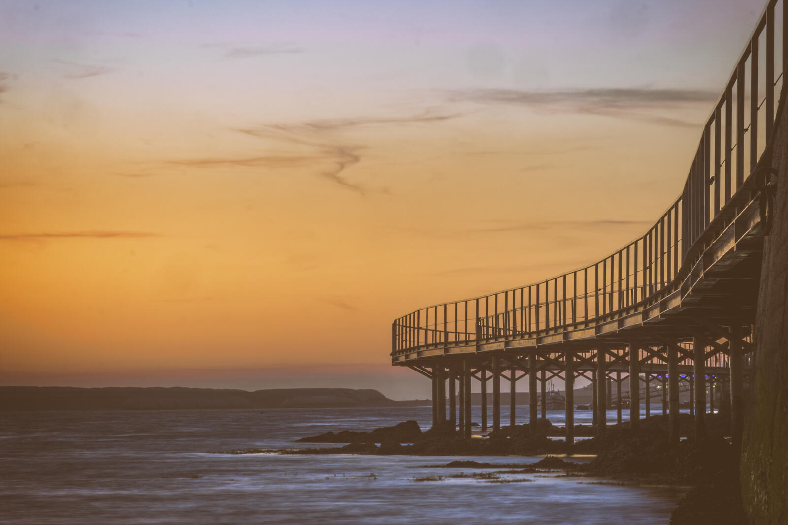 Sunset over the boardwalk near InnEsposende in Esposende, Portugal